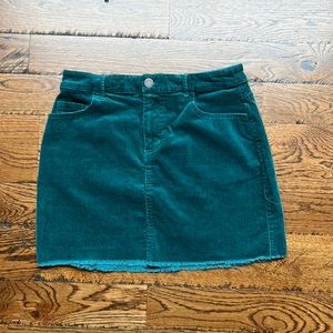 Forever 21 dark green corduroy mini skirt w rough hem, size Small. Length 14”.